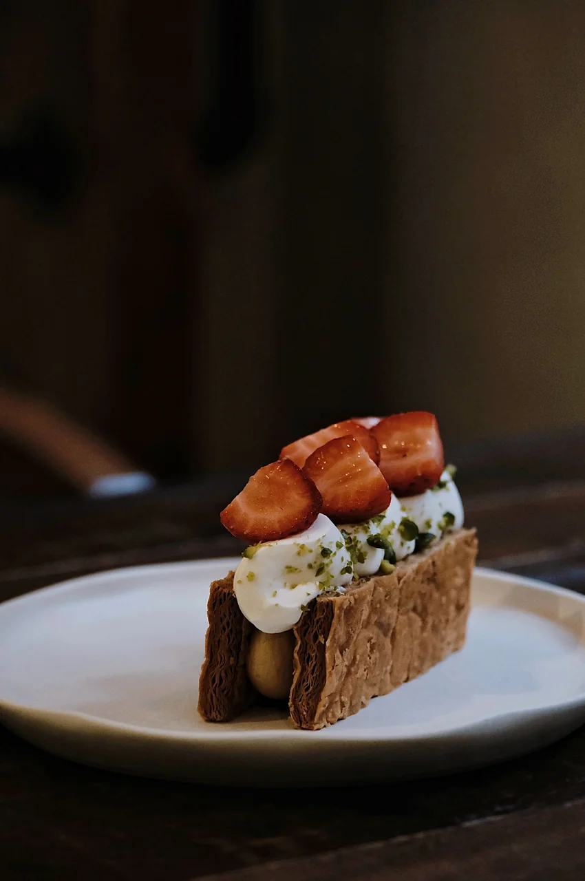 Delicate mille-feuille pastry with hand-folded layers and fresh strawberries