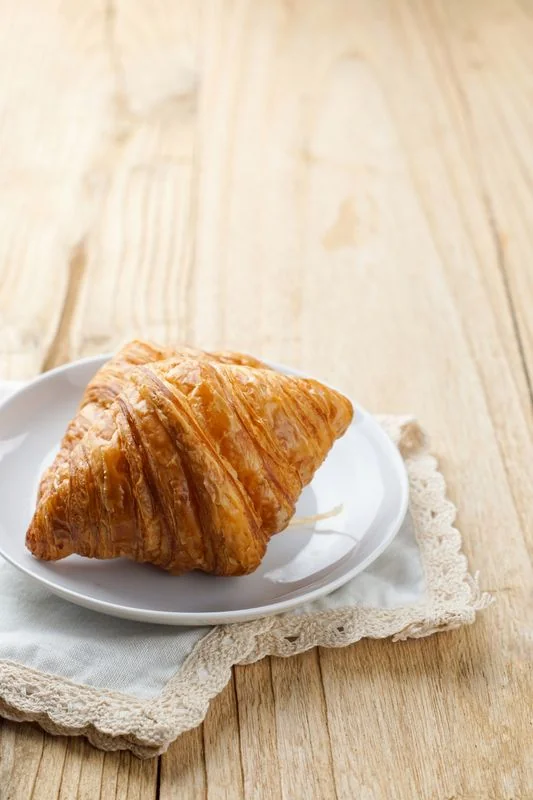 Golden flaky artisan French pastry texture and crust detail